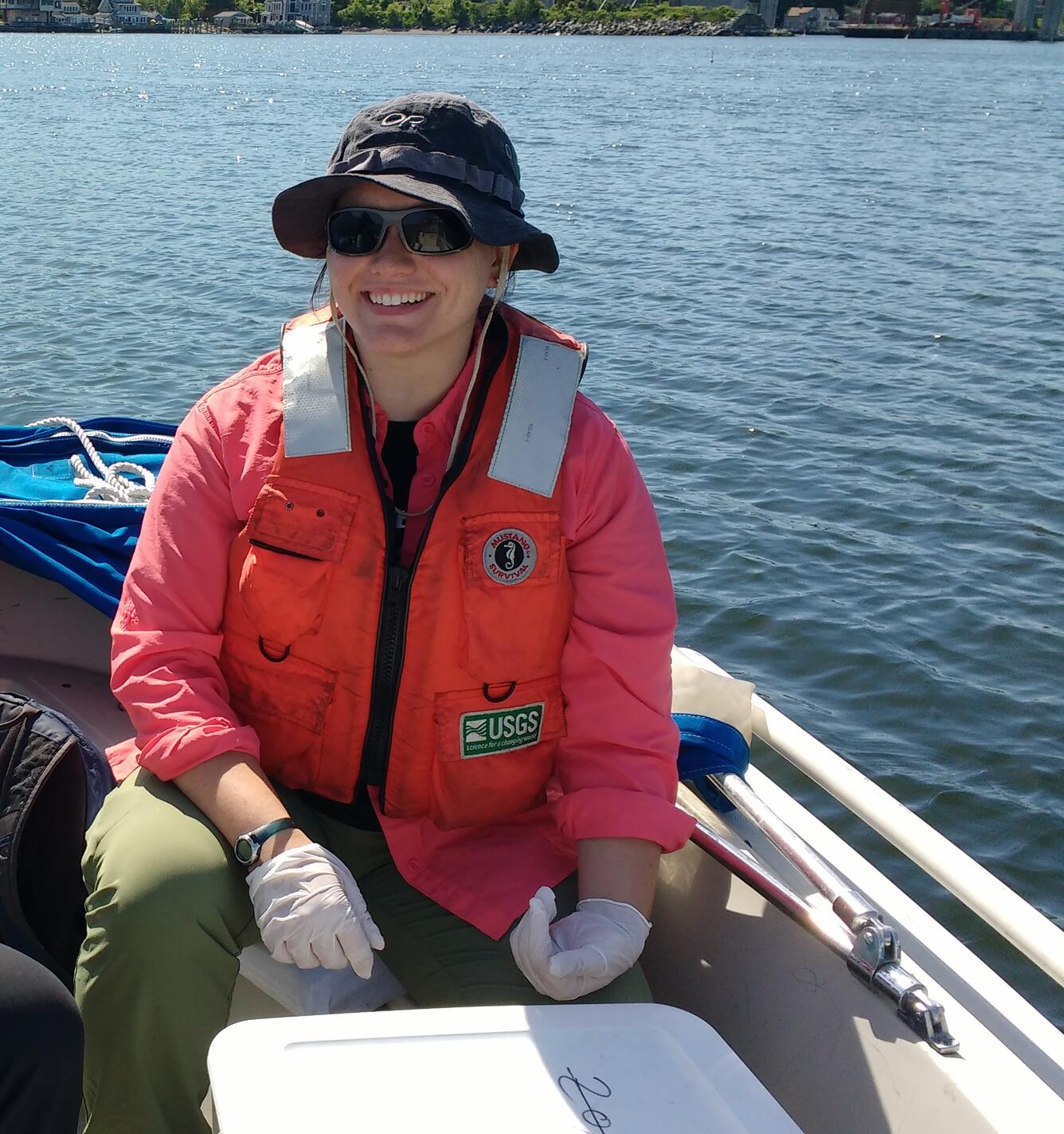 Alana Spaetzel collecting water-quality sample on Sakonnet tidal strait in Rhode Island 