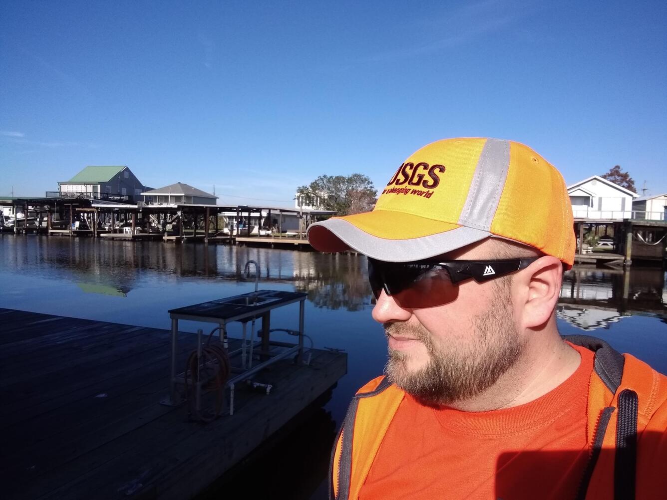 Photo of ecologist, Eric J Ward, bayou in background