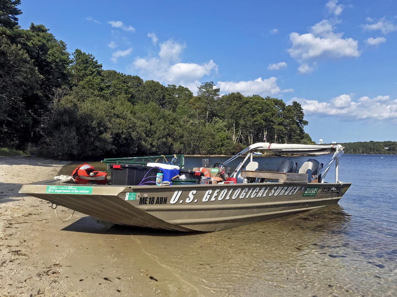 boat, blue sky, water, shore, trees