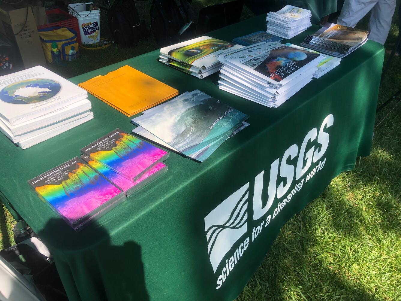 brochures, booklets, and maps on a table