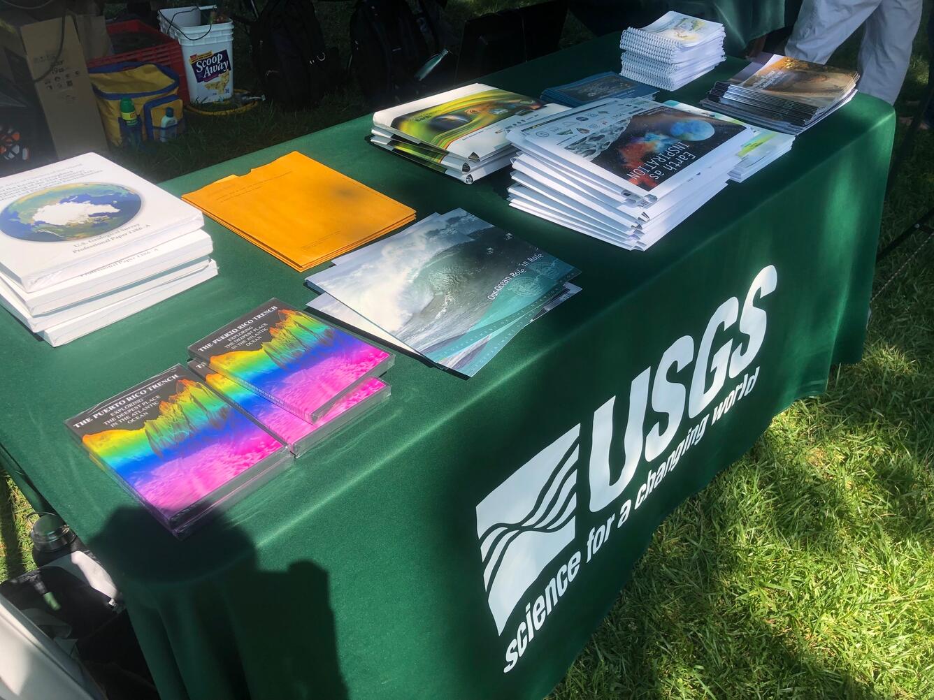 brochures, booklets, and maps on a table