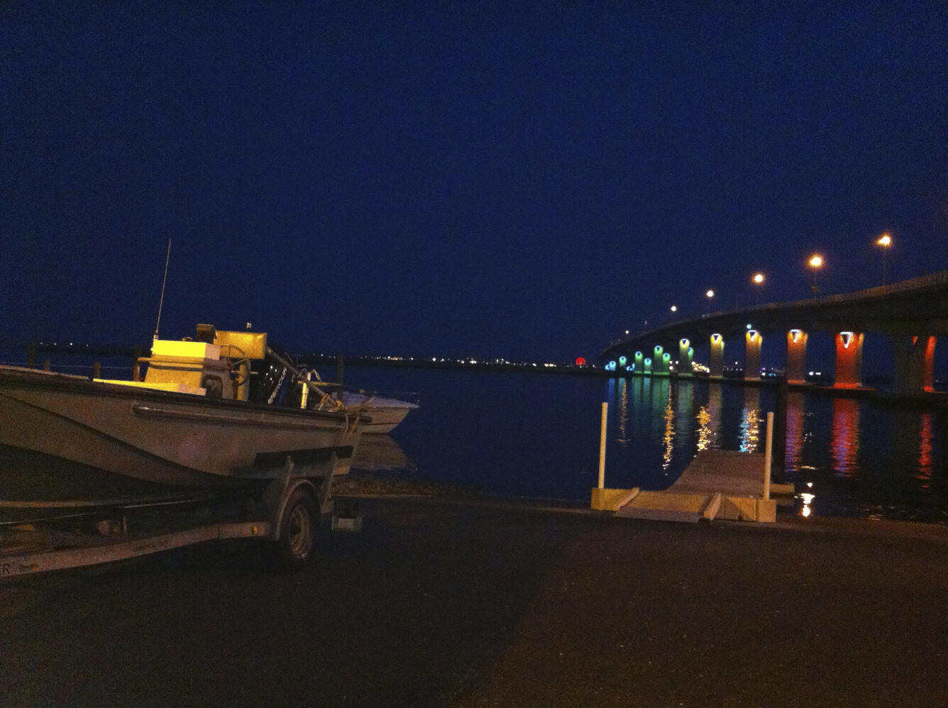 Colorful bridge seen from the docks at night
