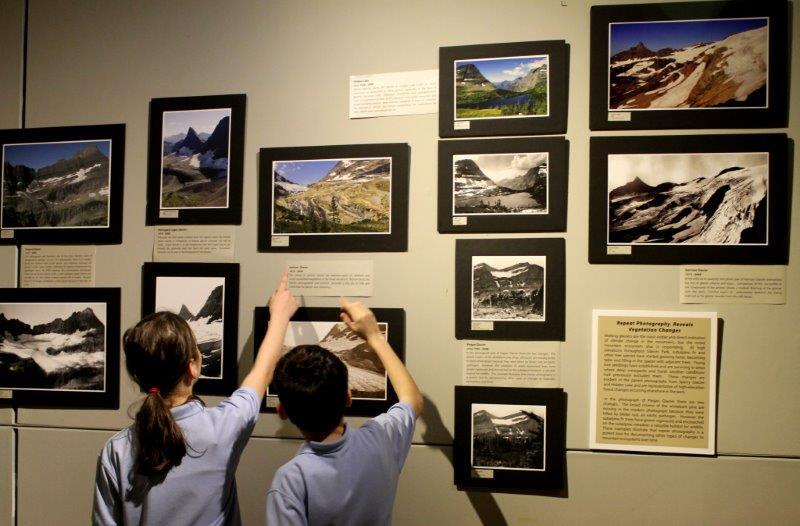 Children examine the Loosing a Legacy exhibit at the MOST museum in Syracuse NY.