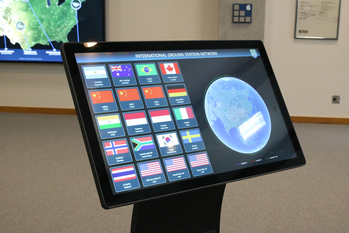 Color photo of Landsat International Ground Station (IGS) Network display at USGS EROS Center