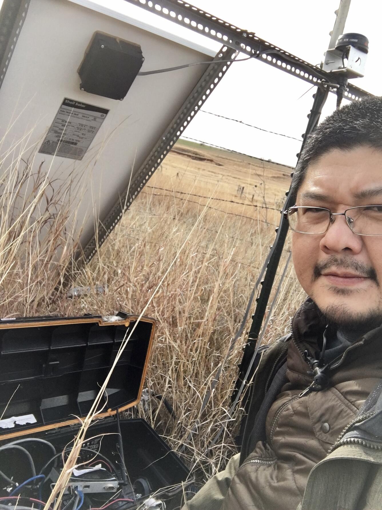 Jefferson Chang servicing a temporary seismic station in the field