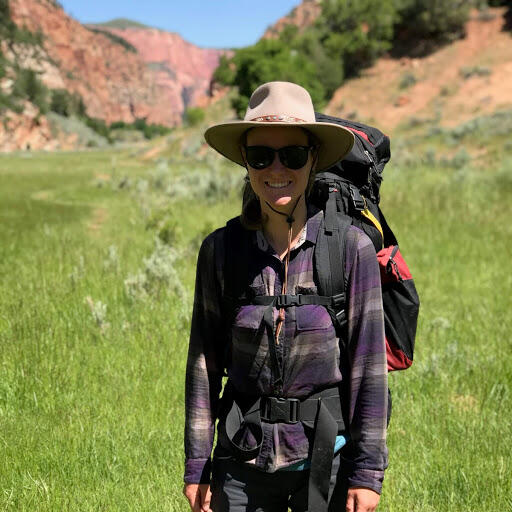 Photo of hydrologist Annie Putman standing in lush Hop Valley of Zion National Park