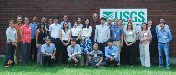 Group photo of scientists in front of NWHC building.