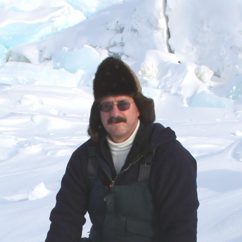 Jeff Bromaghin with a heavy, warm hat on. He is on the Beaufort Sea working with the Polar Bear research team.