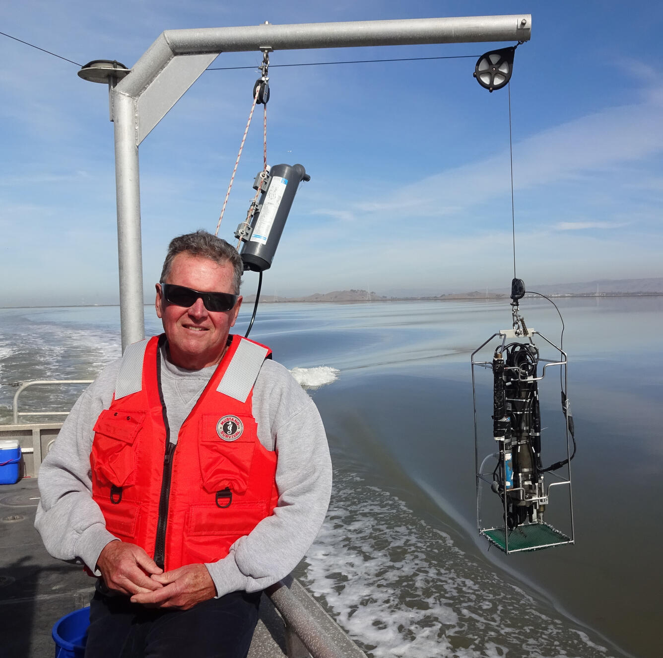 USGS scientist Jim Cloern with a conductivity/temperature/depth instrument package in SF Bay.