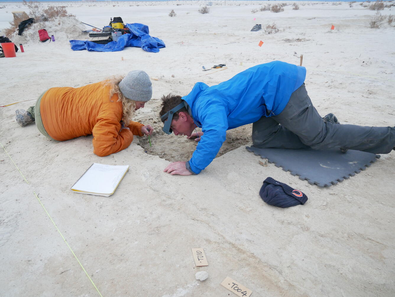 scientists examine fossilized footprints in White Sands National Park