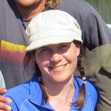 Kim Kloecker standing in front of a group