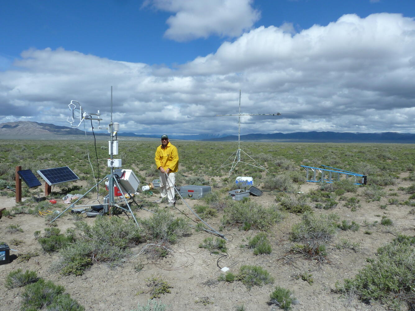 scientist performing maintenance on ET site in Kobeh Valley