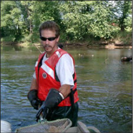 man standing in river