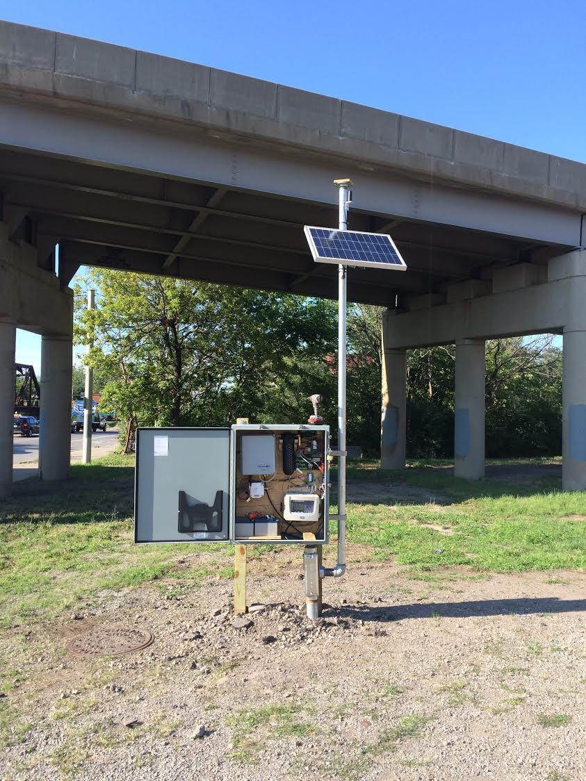 Manhole Cover and Equipment Set-Up near Highway overpass 