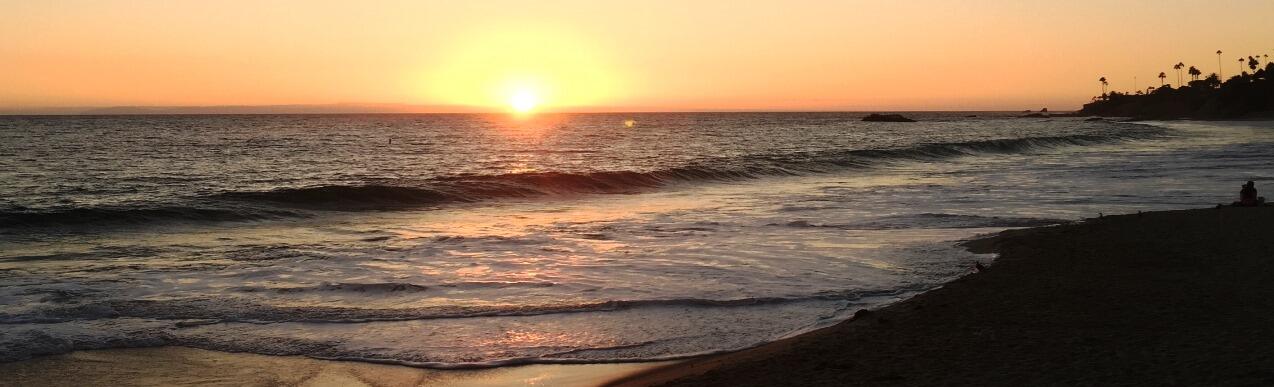 The sunset on the main city beach in Laguna Beach, CA.