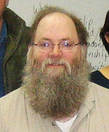 Larry Roberts standing with a group