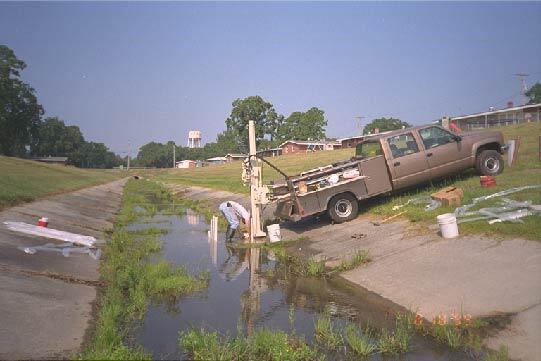 USGS scientist installing monitoring wells in the discharge area of the gasoline plume at the Laurel Bay Gasoline Spill Research