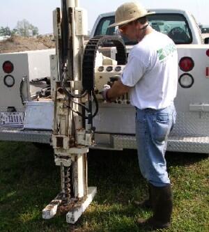 USGS scientist using a direct-push rig to collect sediment samples for analysis at Laurel Bay, South Carolina 