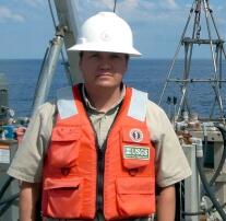 Photograph of Chris Leeth on sampling boat.