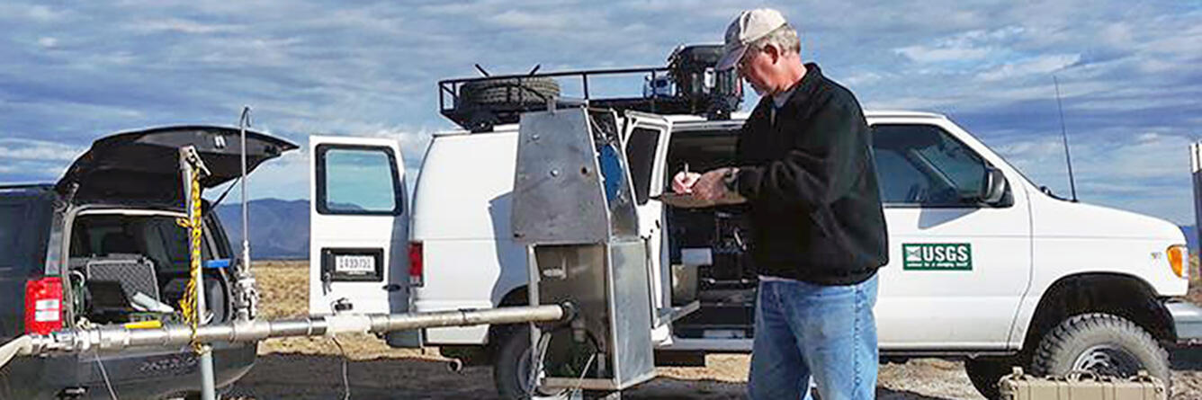USGS hydrologist records data from a monitoring well at the Idaho National Laboratory