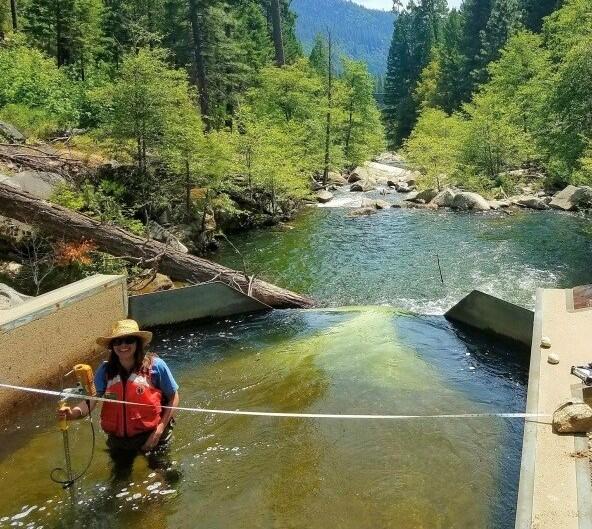 USGS Employee conducts a measurement using mechanical current meter  