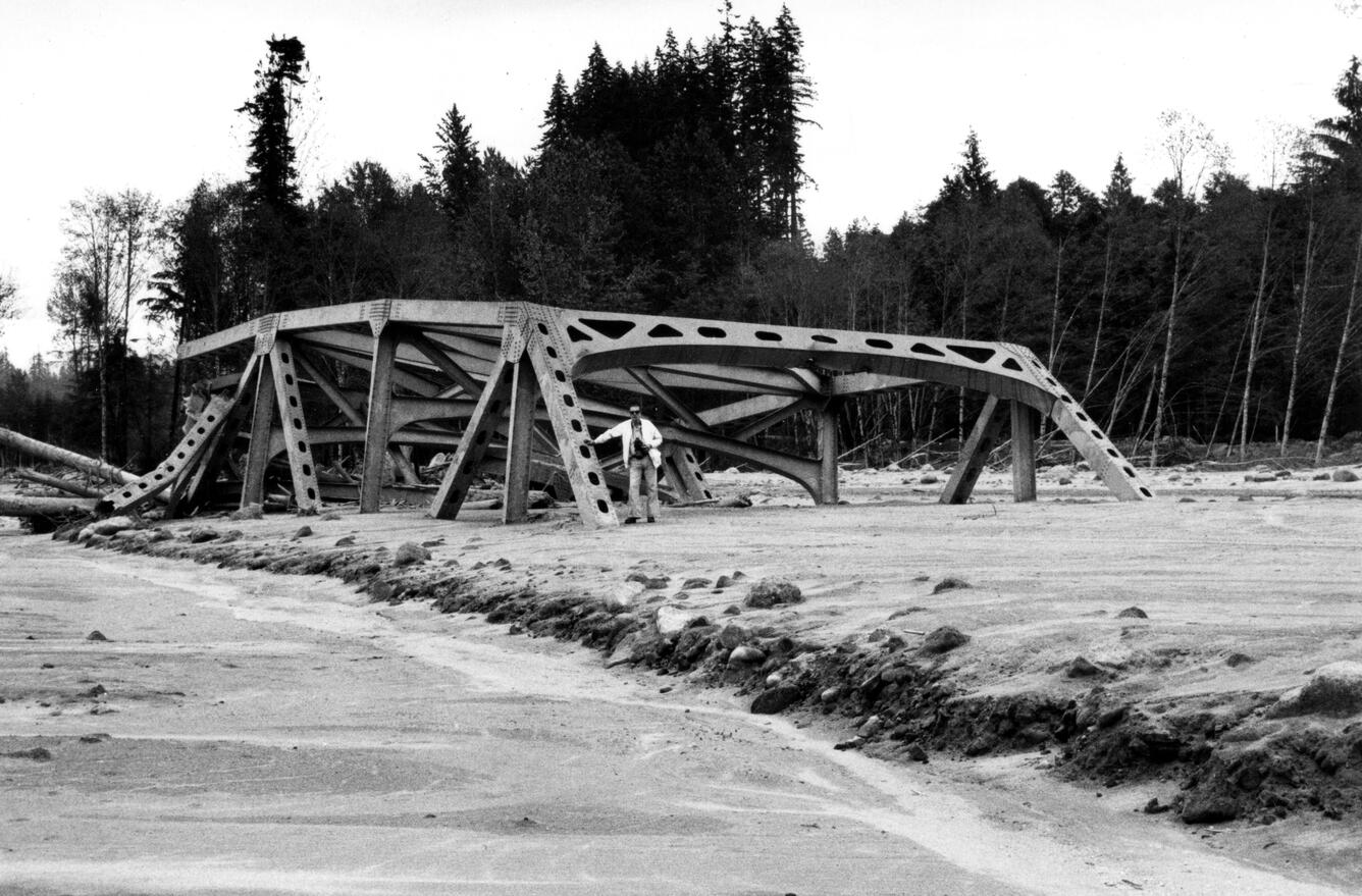 A partially buried bridge in black and white