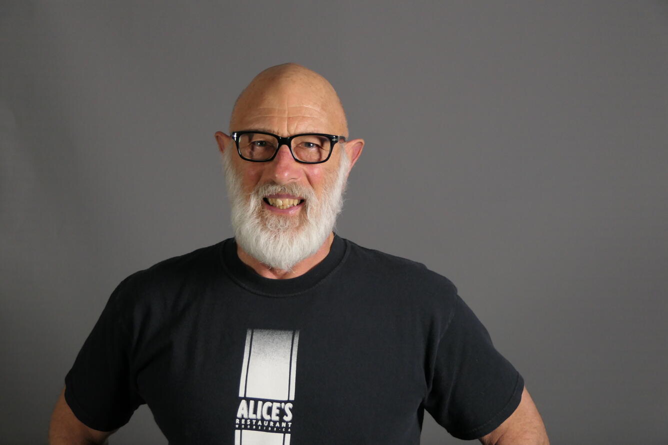 Man standing and smiling at camera