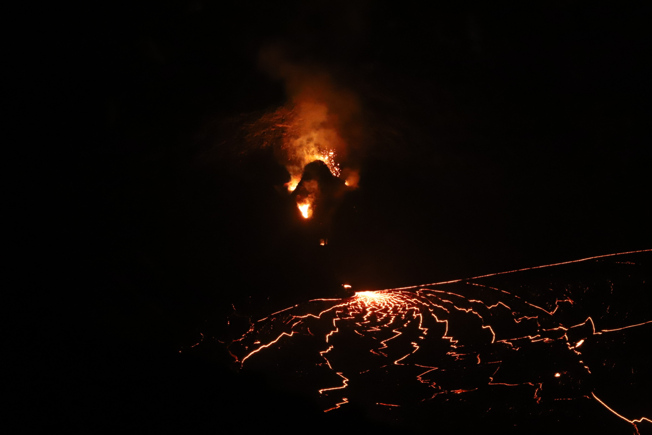 Color photograph of volcanic vent and lava lake