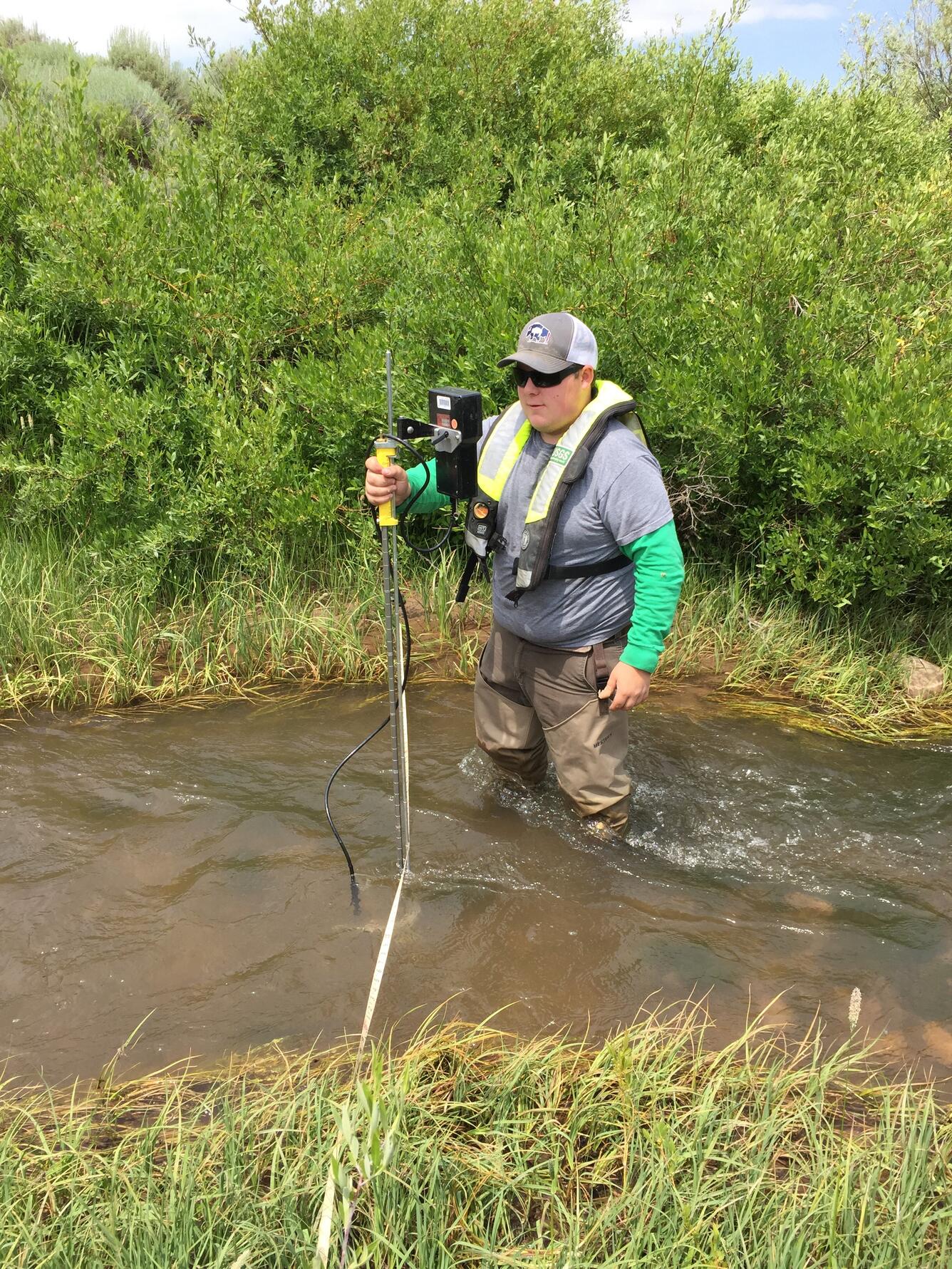 employee standing in stream