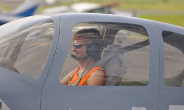 Doug Nebert getting ready to lift off in a private plane