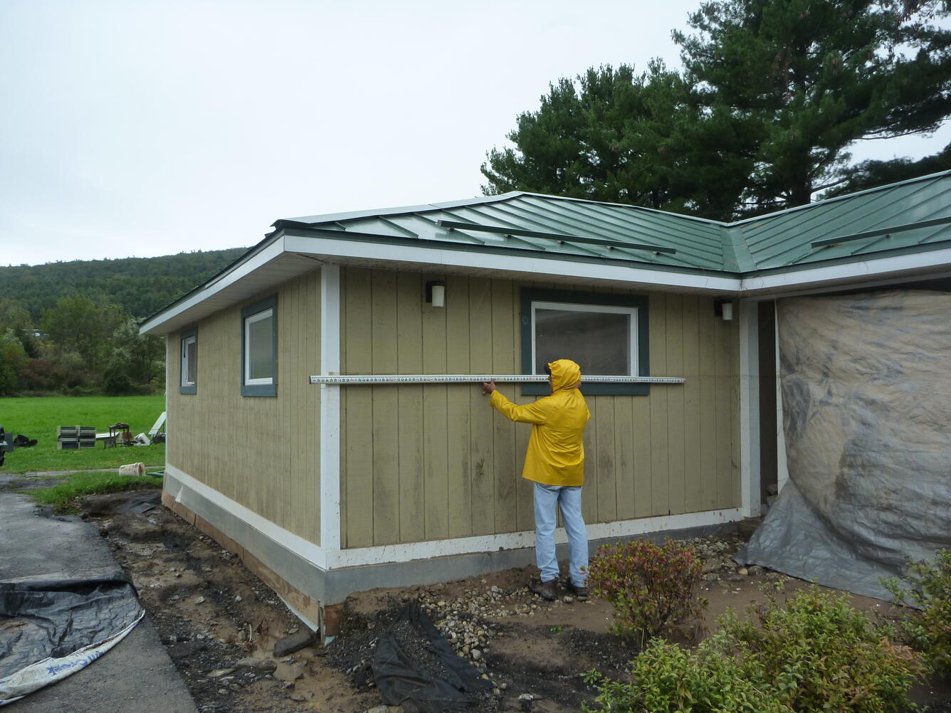 measuring height of floodwater on house