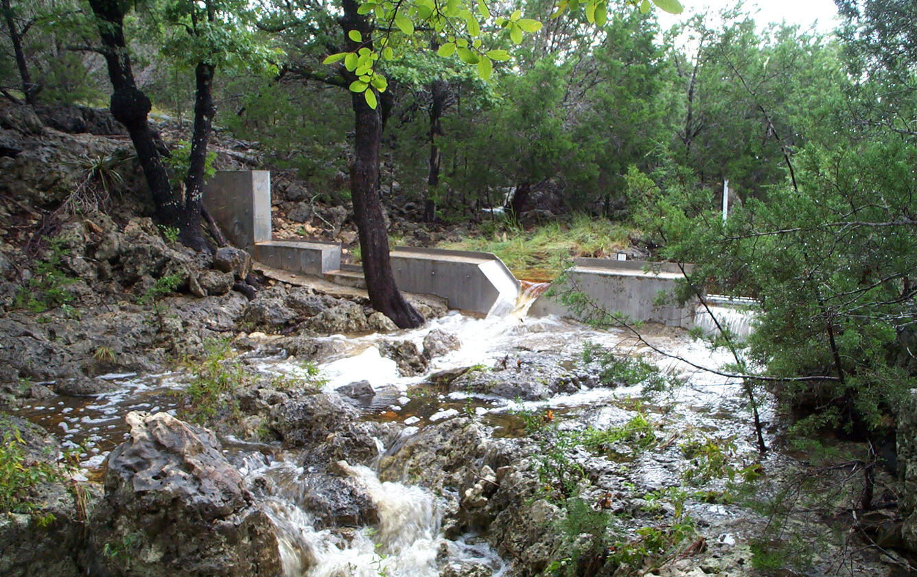Storm-flow over weir in the in the Honey Creek State Natural Area, Comal County, Texas.