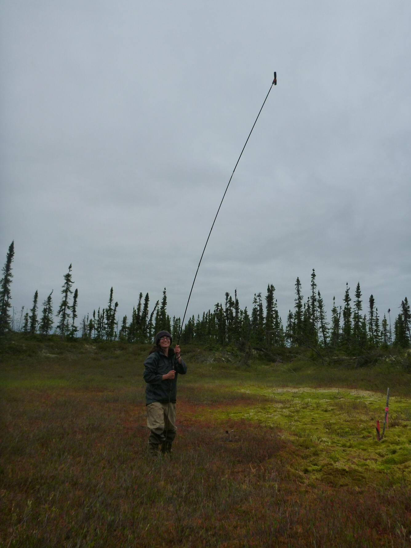 USGS researcher with frost probe