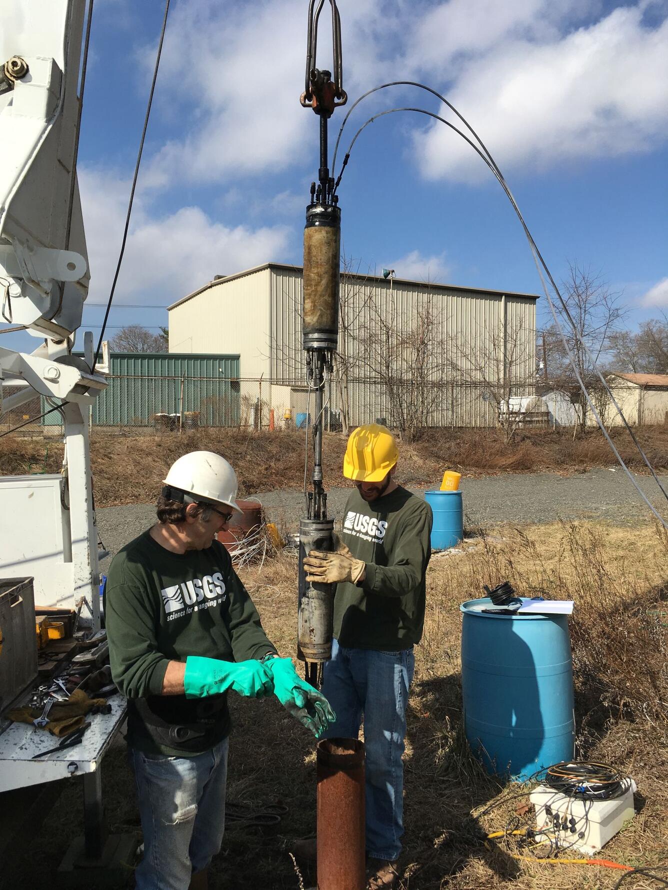 Photograph of USGS hydrologists and packers for well testing