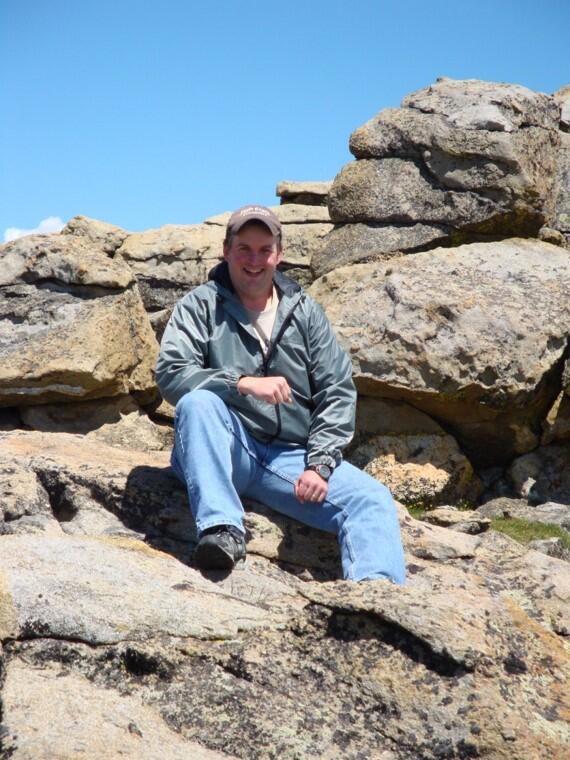 Picture of Chuck Walker sitting on Rock
