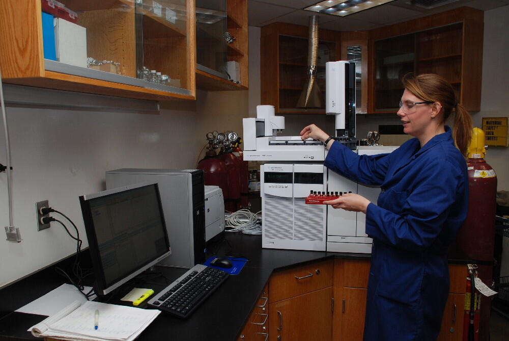 USGS scientist uses a very sensitive instrument to measure concentrations of pyrethroid insecticides in sediments