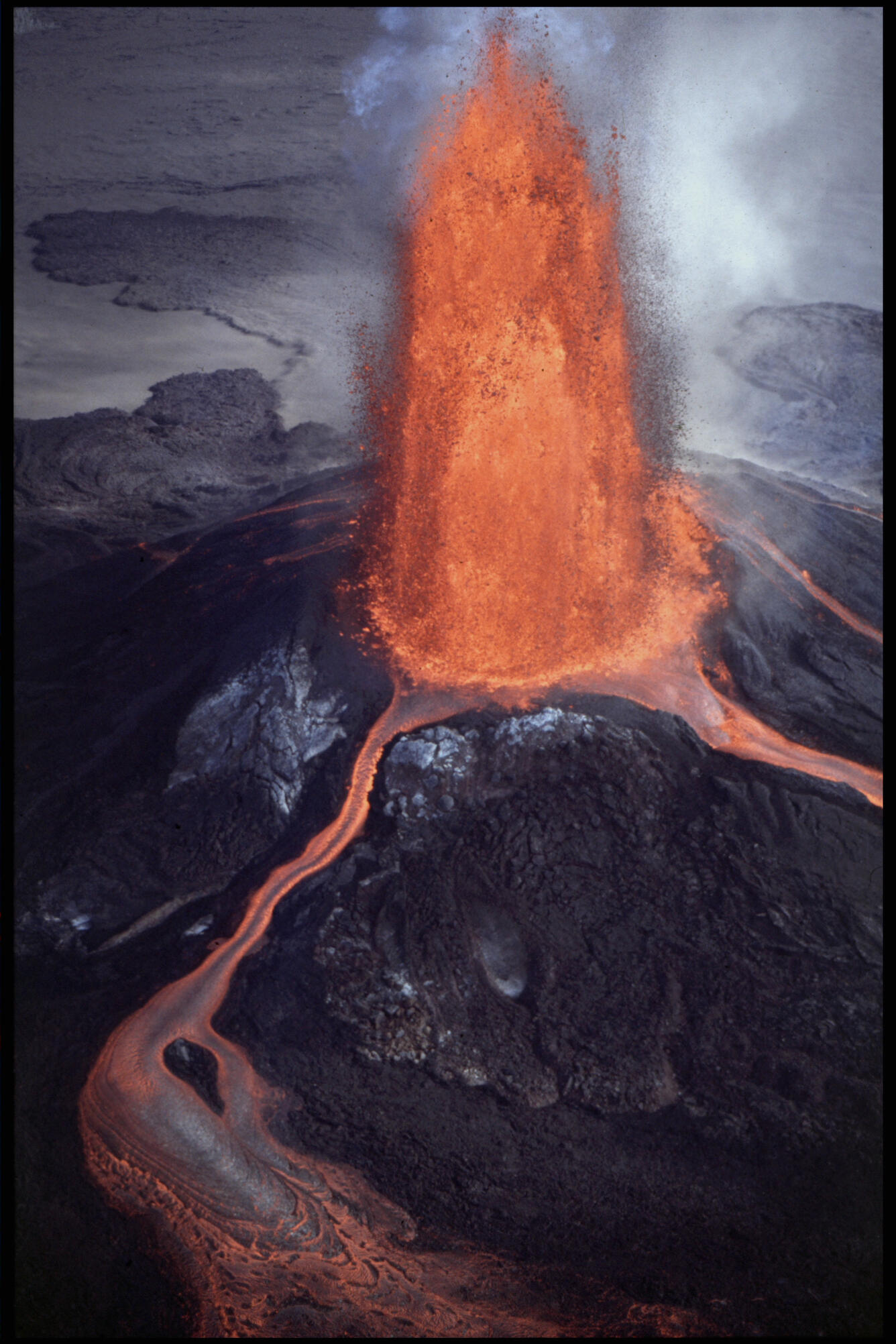 red hot lava fountaining over 100 meters into the air and running off into side channels