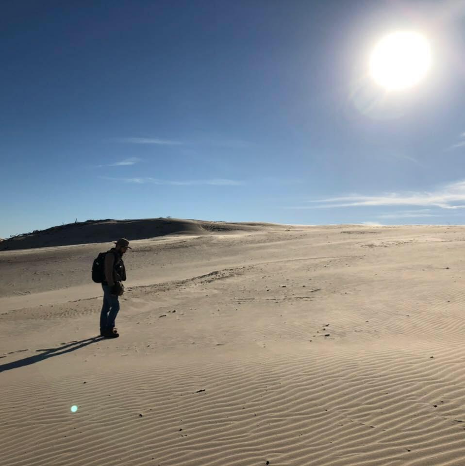 Juan-Marcel Campos at a sand dune