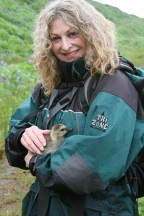 Woman holding a baby goose