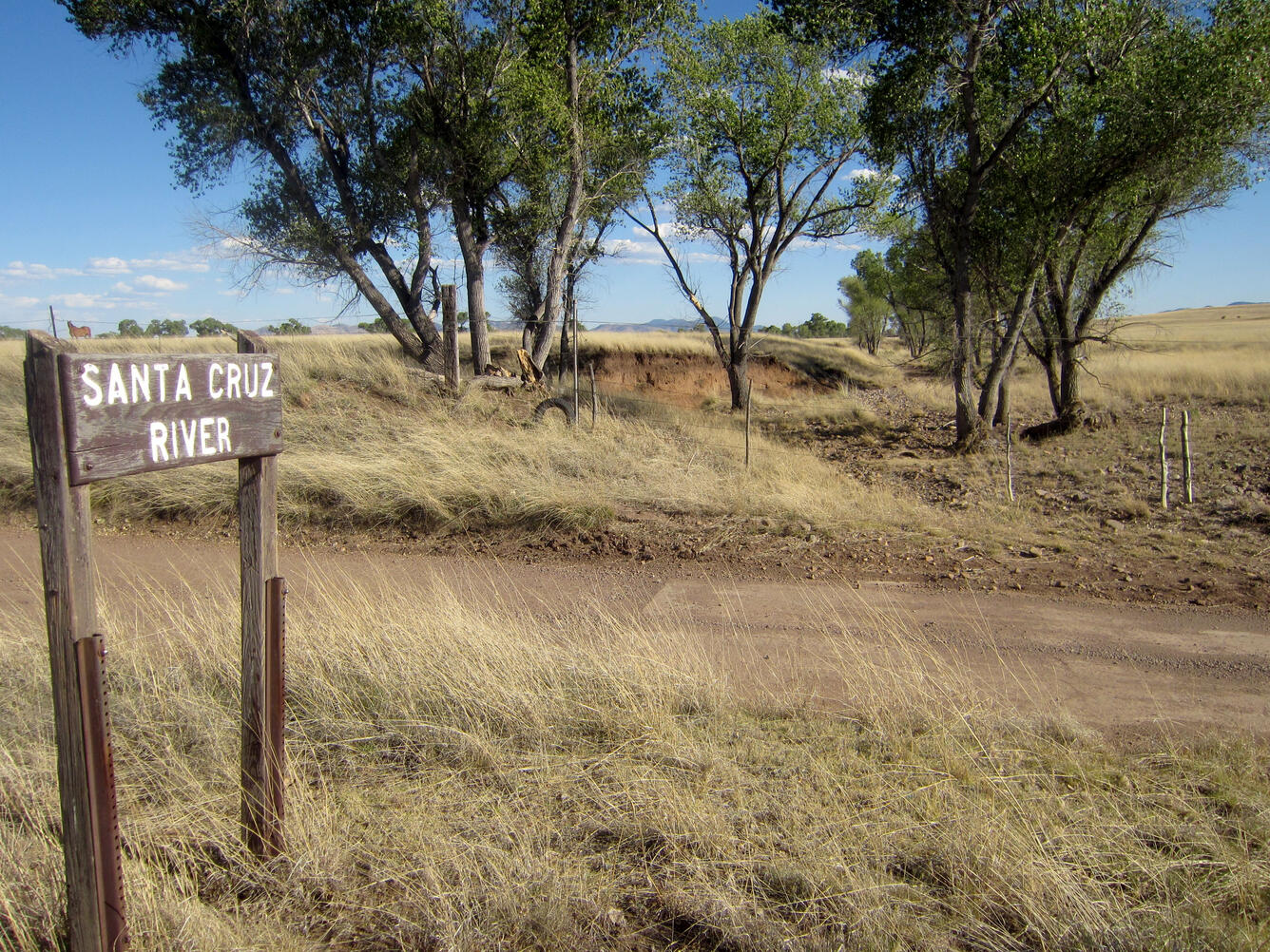 Santa Cruz River sign next to dry bed