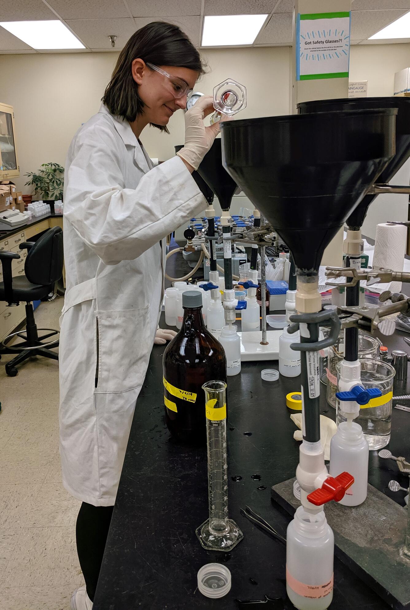 Scientist extracts samples in lab