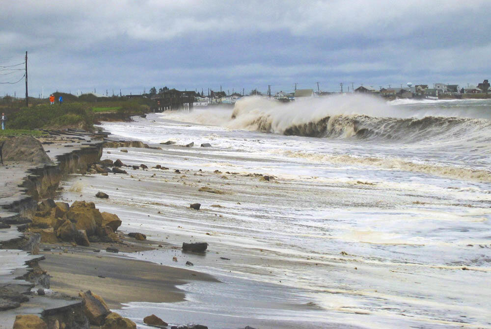 Large waves roll up a rocky beach during a nor'easter in Rhode Island in 2005