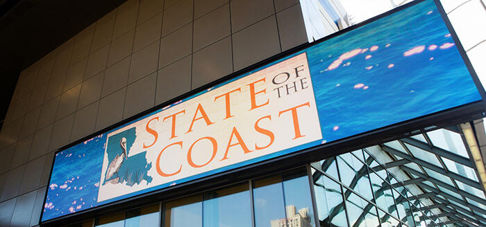 State of the Coast Conference logo on sign