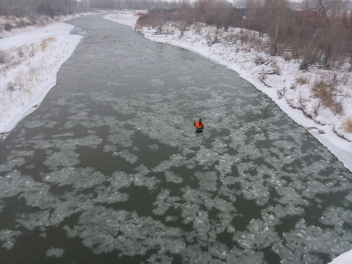 Measuring streamflow in slushy Sun River at Simms, MT