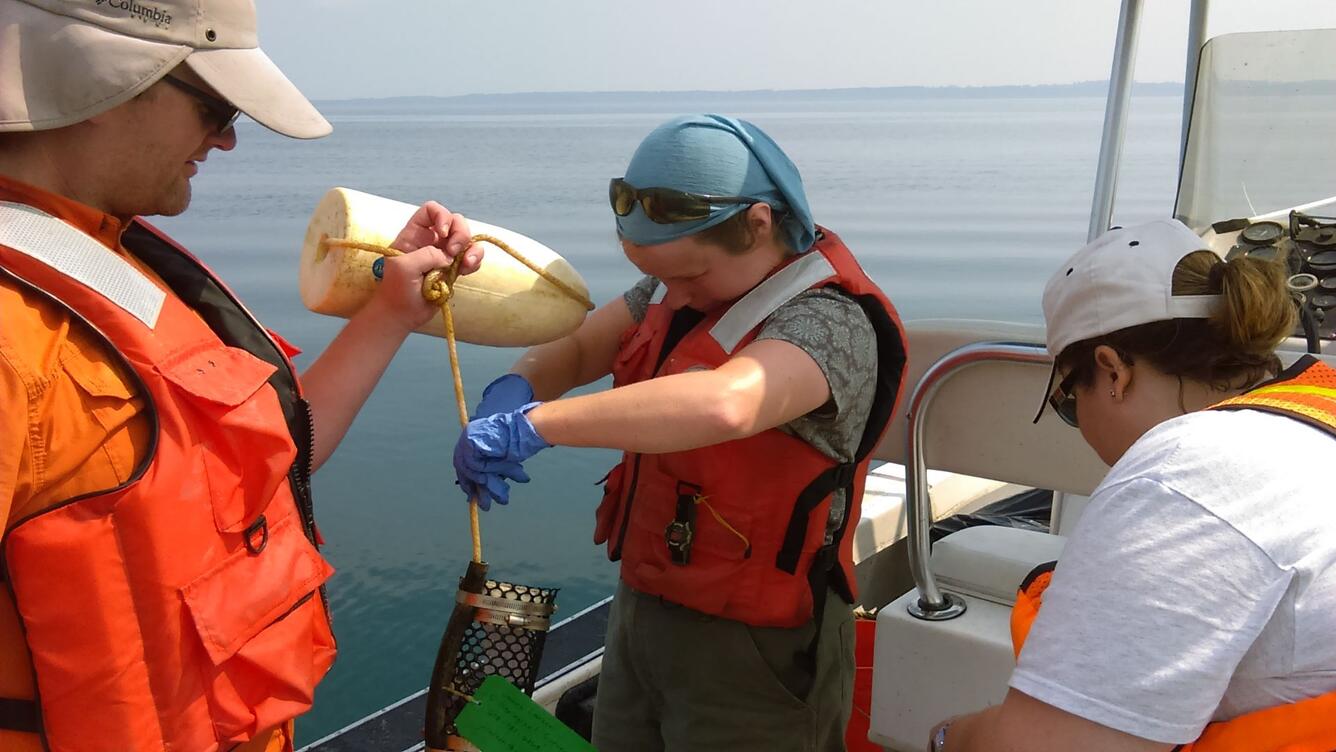 USGS scientists retrieve and process samples from an ecological processing monitoring station