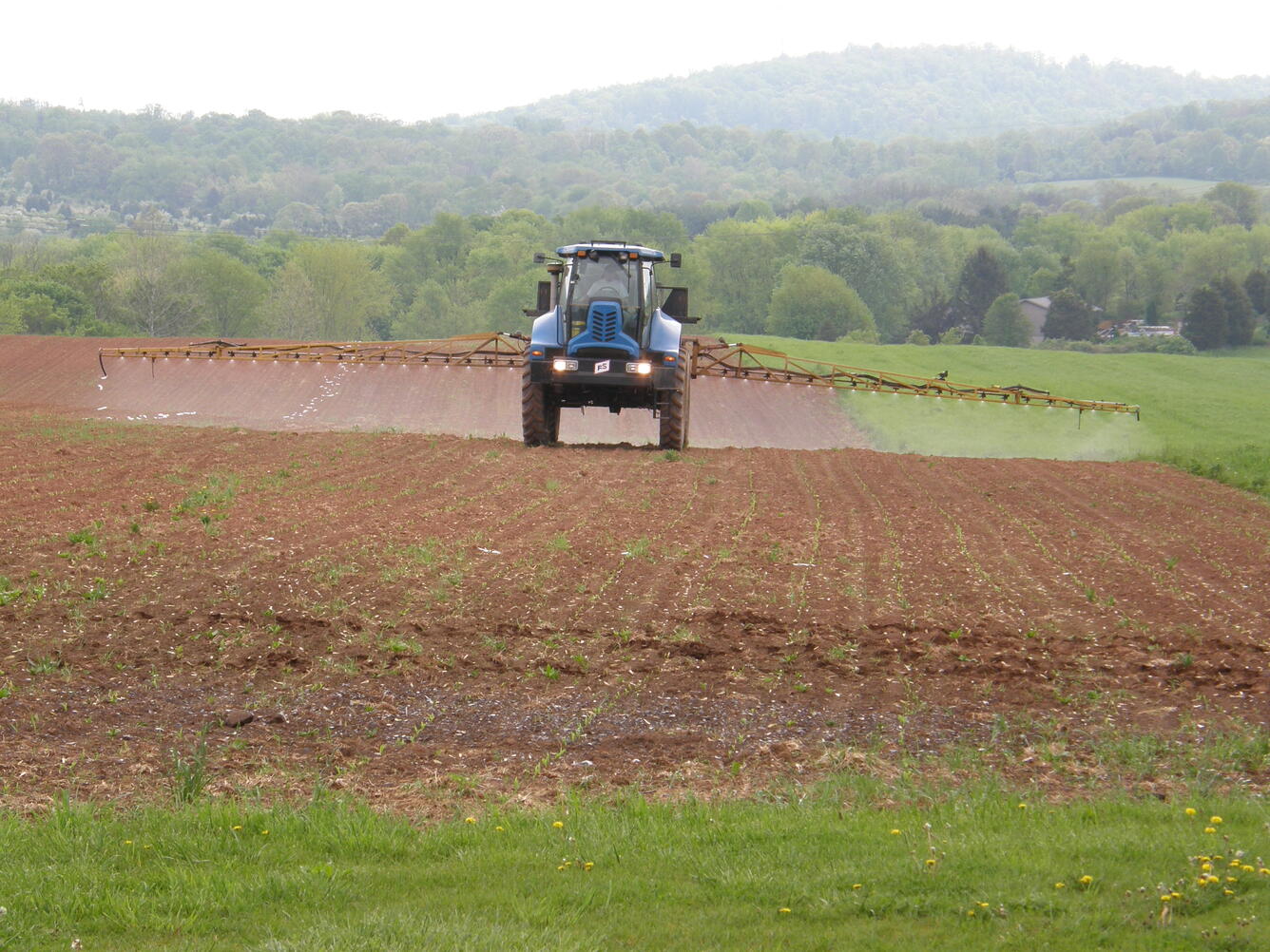 Tractor applying pesticides