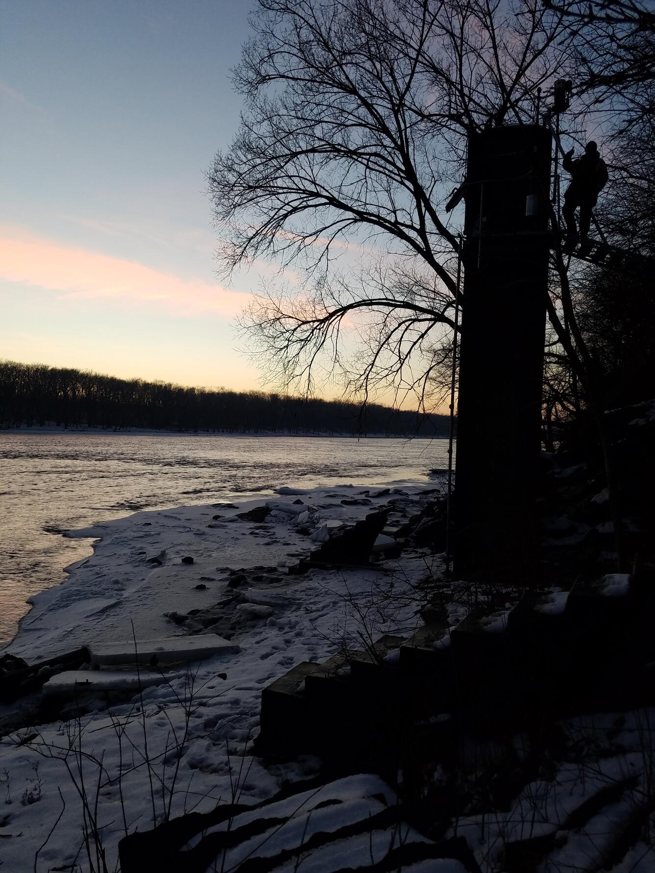Hydrologic Technician attempts to unfreeze float