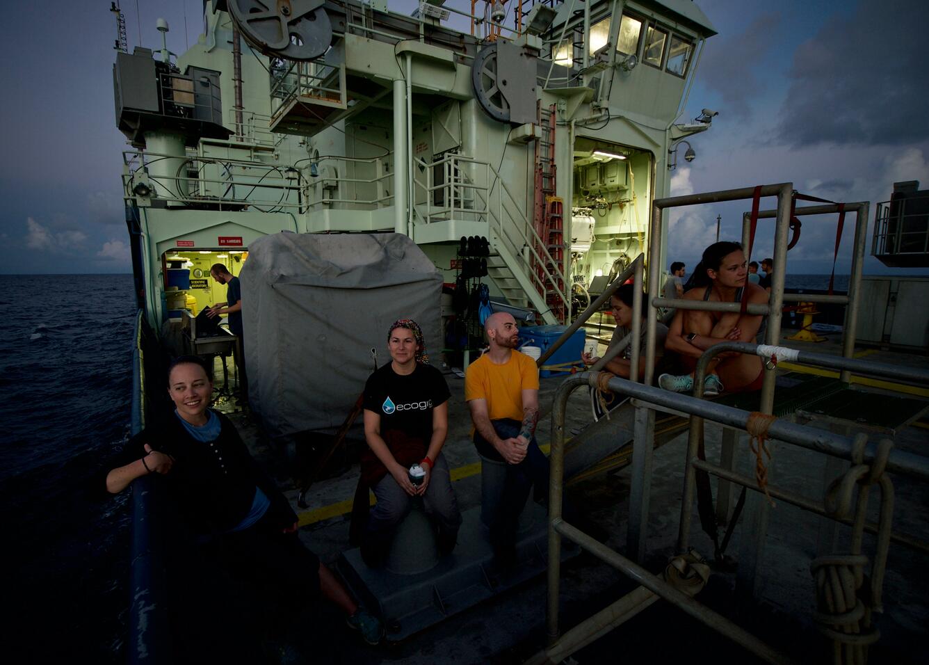Scientists aboard a deep-sea expedition enjoy the sunrise following an all-nighter of sample processing