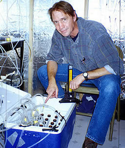 USGS scientist collecting gas samples for analysis of Carbon-14 gases from a deep test hole at the Amargosa Desert Research Site