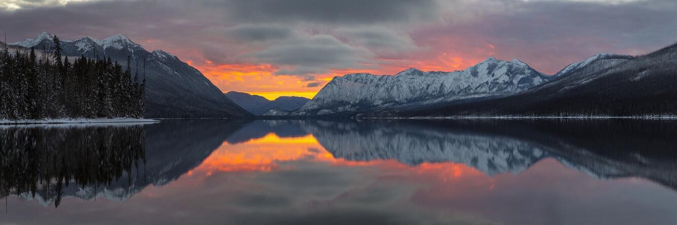 landscape showing a lake and clouds at dawn